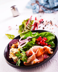 bacon with cheese on green salad