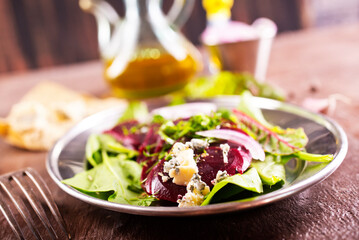 Tasty salad of beetroot, cheese and nuts. Copy space.