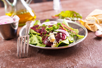 Tasty salad of beetroot, cheese and nuts. Copy space.