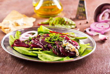 Tasty salad of beetroot, cheese and nuts. Copy space.