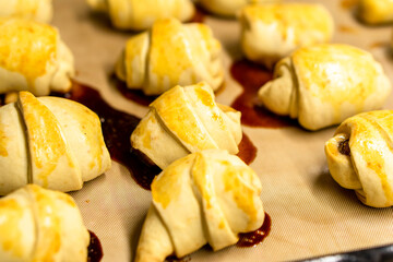 Crispy crescent rolls with jam. Dessert. Homemade croissants with jam