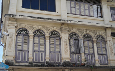Detailed view of windows, doors and balconies of city buildings 