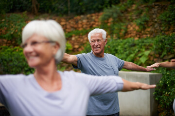 Park, senior or man in yoga class for stretching arms, balance or inner peace in nature. Group...
