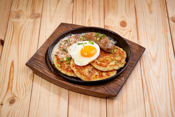 potato pancakes with sausage and sauce