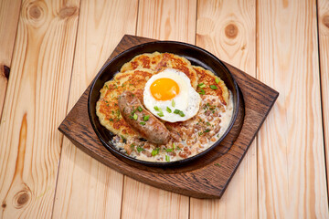 potato pancakes with sausage and sauce