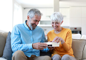 senior woman man couple love elderly praline present sweet birthday gift dessert chocolate...