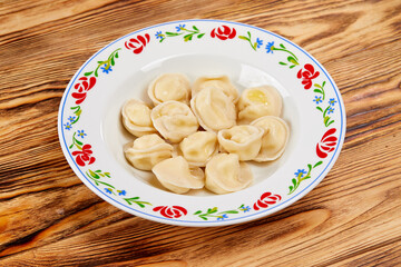 tasty dumplings on the wooden background