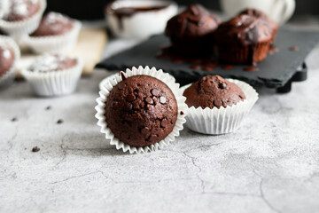
chocolate cupcakes with chocolate chips.on a gray table.dessert