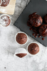 
chocolate cupcakes with chocolate chips.on a gray table.dessert