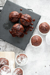 
chocolate cupcakes with chocolate chips.on a gray table.dessert