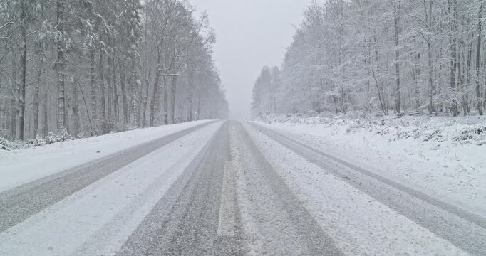 Snowy Winter Roads - Heavy snowfall on a mountain road - Lockdown shot