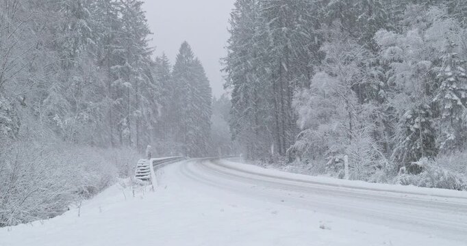 Snowy Winter Roads - Heavy snowfall on a curvy mountain road - Lockdown shot