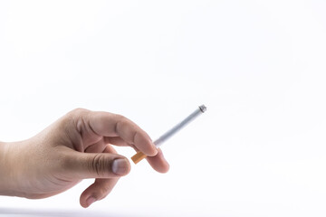 Cigarette in hand isolated on white background - the concept is smoking killing you.