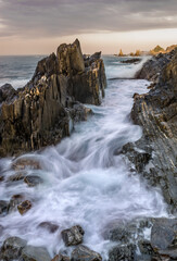 Spectacular landscape in the Cantabrian Sea with waves breaking against the rocks