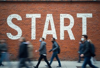 A brick wall with the word START painted on it in white letters