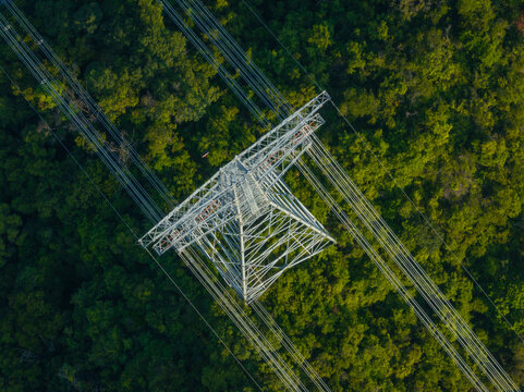 Aerial view of high voltage electricity tower on mountain