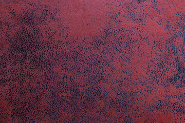 Red artificial suede upholstery fabric textured background