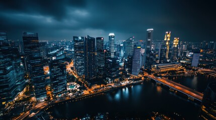 Nighttime Aerial View of Illuminated Skyscrapers and a River in a Modern City