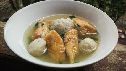 bakso tahu kuah or tofu meatballs with sauce. Typical West Javanese Indonesian food is usually served warm. made from chicken or beef and flour. meatball soup