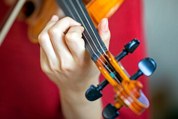 play the violin with the left hand. Correct positioning of the hand and fingers on a musical...