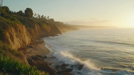 Cliffside View of Coastal Landscape with Ocean and Breaking Waves at Sunset