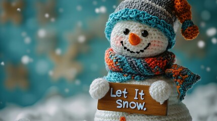 Smiling crochet snowman holding let it snow sign during snowfall