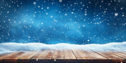 Festive winter scene with snow-covered wooden table and falling snowflakes against a blue background, perfect for seasonal and holiday themes.
