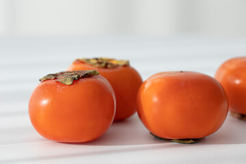 Fresh orange persimmon isolated on white background