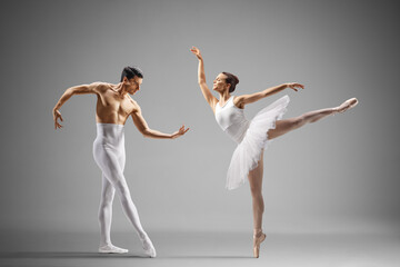 Ballet dancers in white clothes performing