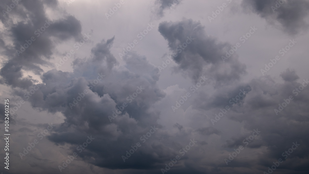 Wall mural dark sky with stormy clouds. dramatic sky rain,dark clouds before a thunder-storm.