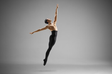Male ballet dancer performing a jump