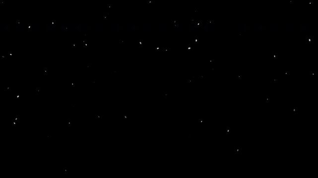 Snowfall isolated on black with alpha channel. Seamless loop video. Available alpha channel in 2160 resolution