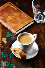 Cup of coffee and Cantuccini (Italian cookie) on dark wooden background. Copy space.