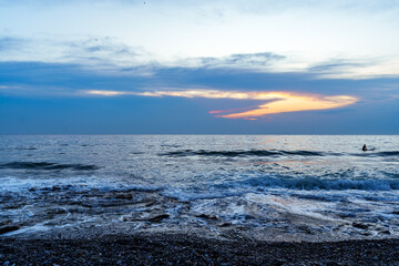 Tranquil Ocean Sunset With Vibrant Skies and Gentle Waves..