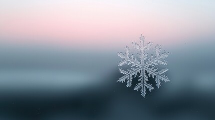 A snowflake is floating in the air above a blue sky