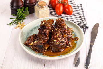 Prepared tasty beef ribs with sauce