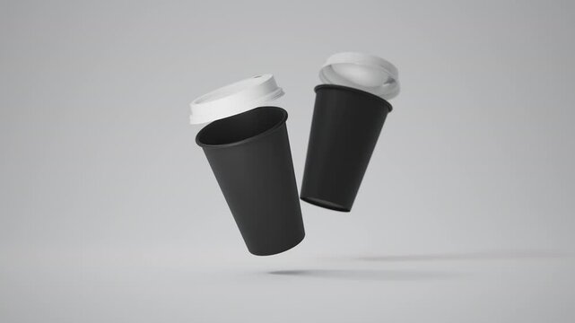 Two Minimalist Black Blank Paper Coffee Cup floating above white background. Takeaway paper coffee cups flying. Loop, 4k, 3d render