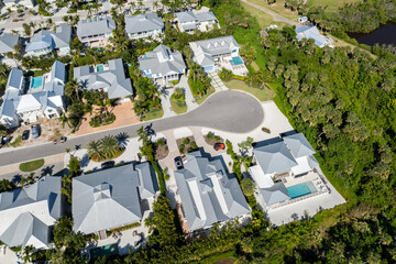 Obraz premium Boca Grande, Florida. Expensive waterfront houses between green palm trees. Premium housing development in the USA