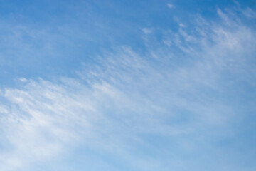 A beautiful sky tinted by the sun leaving vibrant shades of gold, pink, blue and multicolored. Clouds in the twilight evening and morning sky. Cloudy sky background in the evening, and during the day.