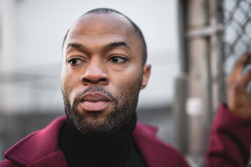 Fashion portrait of black man in city in modern spring or fall season outfit.