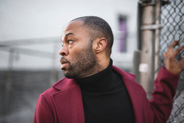 Fashion portrait of black man in city in modern spring or fall season outfit.