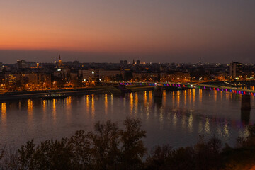 Fototapeta premium Panorama of Novisad on the Danube after the red sunset