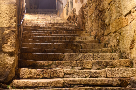 Fototapeta old stone stairs in the streets of the roman ancient city of Tarragona