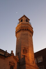 Lighthouse tower in the dusk and moon
