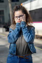 Girl at train station blows a kiss