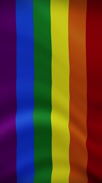 Rainbow LGBT Waving Flag in Vertical Orientation. Realistic Flag Animation. Seamless Loop Background.