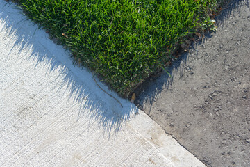 where sod, pavement, and asphalt covers meet