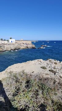 Waves crashing on rocky coastline of tabarca island