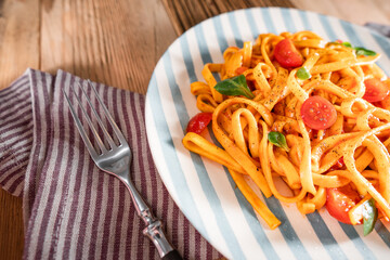 Pasta with tomato sauce and basil. Delicious tagliatelle. Italian tasty food