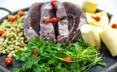 Traditional rustic tropical Brazilian dish, sun-dried beef with green beans, cassava, biquinho pepper. Creative rustic photography